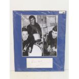 An original Pete Best of The Beatles signature mounted alongside a contemporary photograph.
