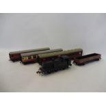 A Hornby Dublo 0-6-0 tank locomotive, Royal Mail coach and two others.