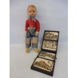 A Deans Rag Book Company 'Dutch Boy' doll with cloth body, plus an album of postcards, Croydon,