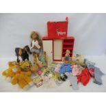 An early Pippa carry case with clothing, dolls and accessories, plus a horse, more clothing, and