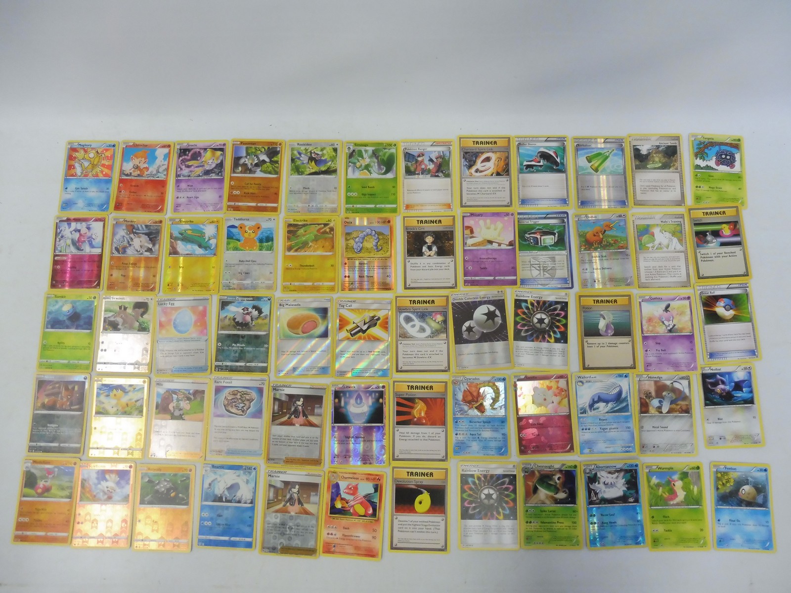 Pokemon tin full of Holo, commons and uncommon cards around 500 in good condition.