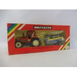 A boxed Britains rainbox pack 1:32 scale circa 1980 Fiat tractor and accessory, no. 9585, box fair