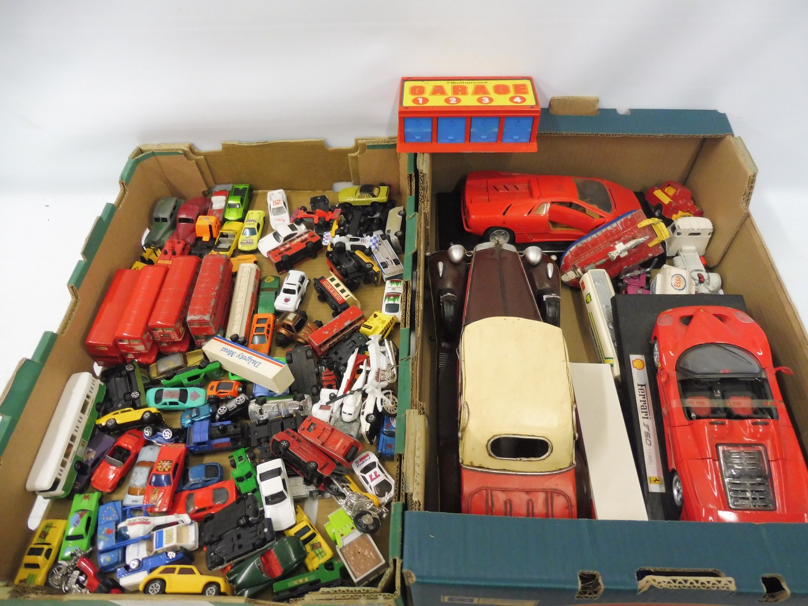 A tray of assorted playworn die-cast models of different scales.