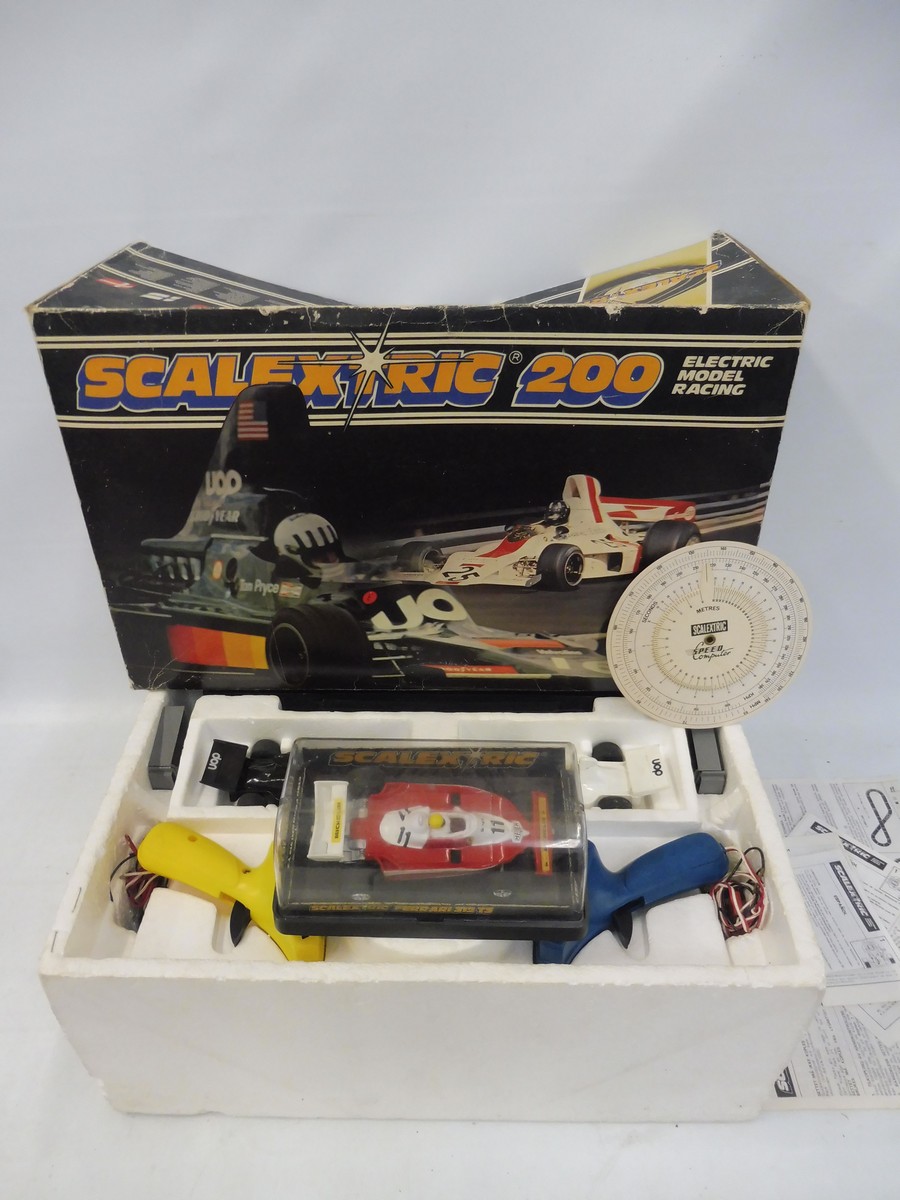 A Scalextric 200, appears complete and in very nice condition, plus an extra car, a Ferrari 312.