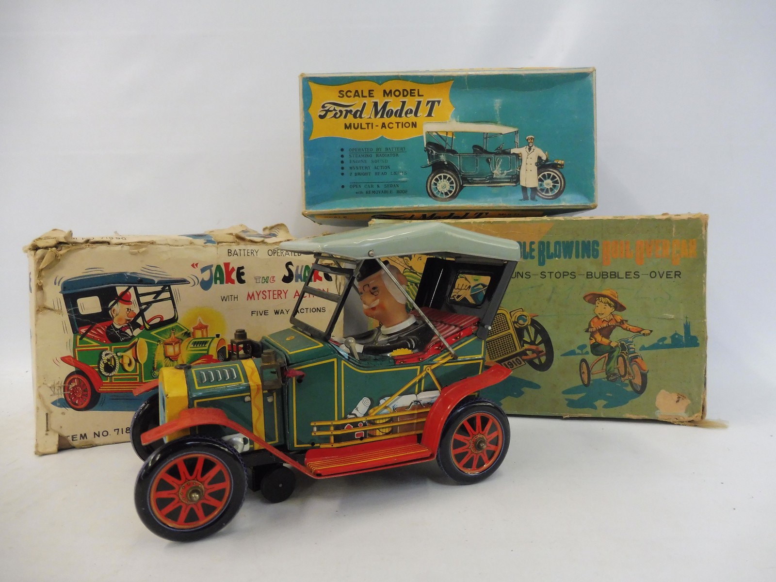 A boxed Japanese tinplate battery operated 'Jake the Shake' and an empty box for 'Bubble Blowing