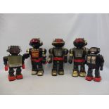 Five plastic robots, mostly 'Made in Hong Kong'.