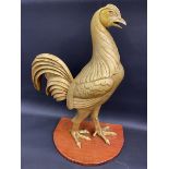 A Courage brewery advertising cockerel figure on a wooden base, 26" high.