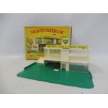 A boxed Matchbox Service Station, MG-1, by Lesney, box listed for all markets abroad.