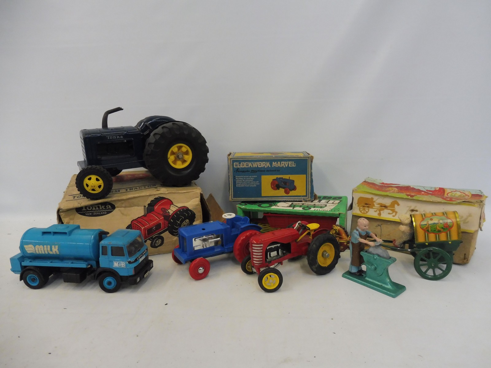 An assortment of mainly agricultural boxed models plus some loose including Britains.