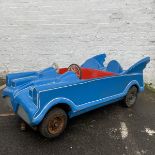 An original circa 1960s blue Batmobile fairground ride with pin striping, red interior and of