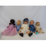 A Rosebud composite doll, and four larger 1950s dolls.