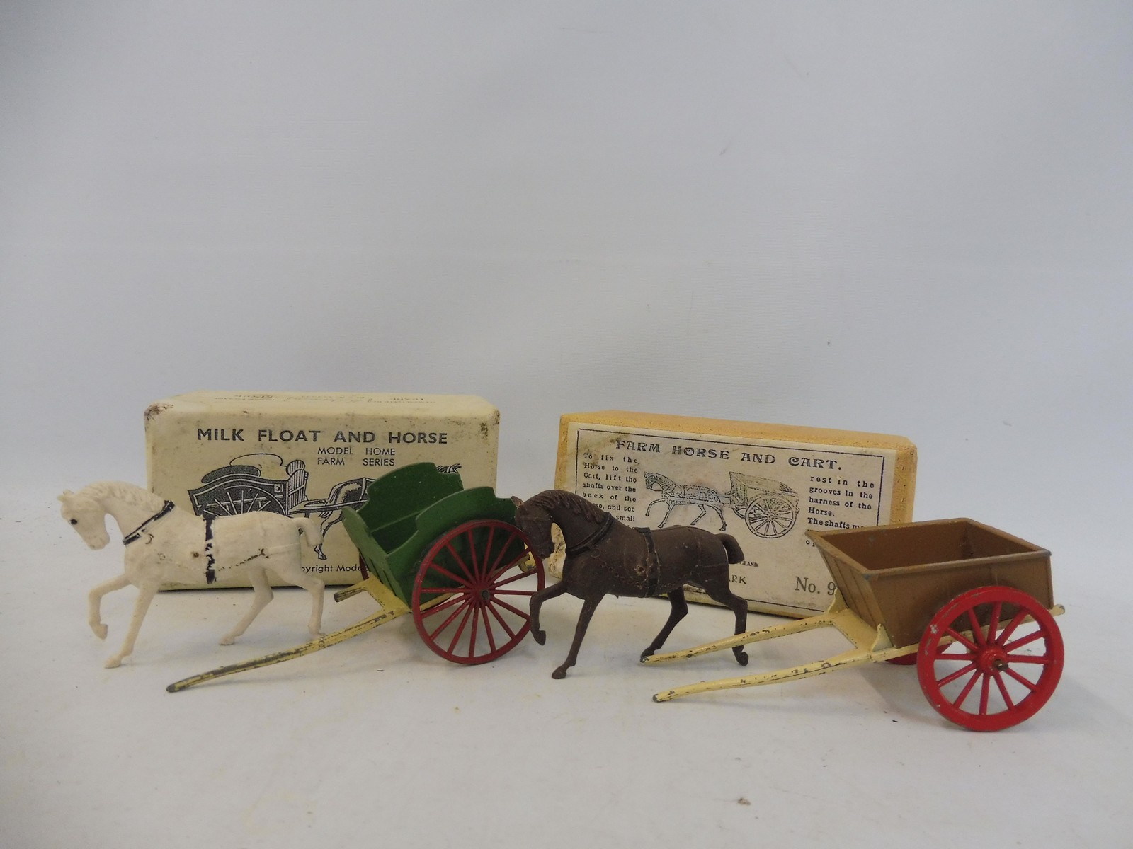 An early boxed Britains milk float and horse, model appears in playworn condition, plus a boxed farm