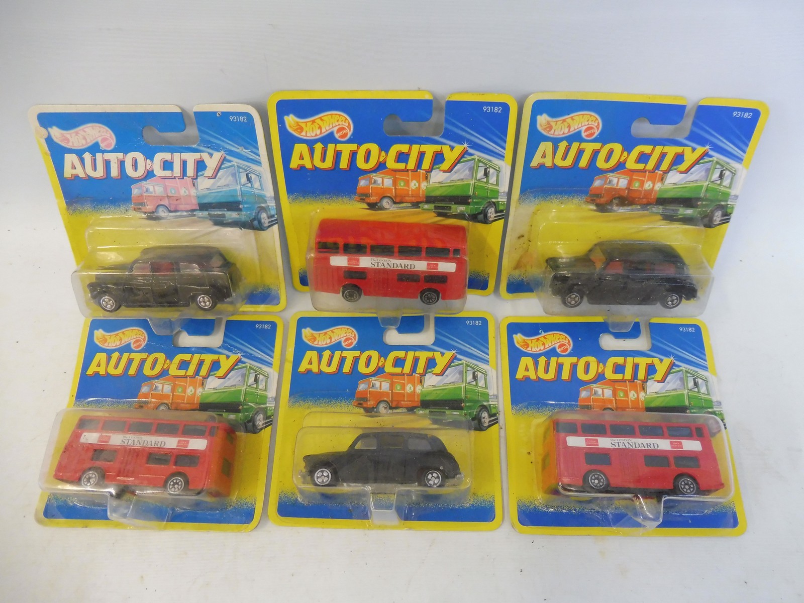 Six assorted Hot Wheels carded Auto City, to include London taxis and buses.