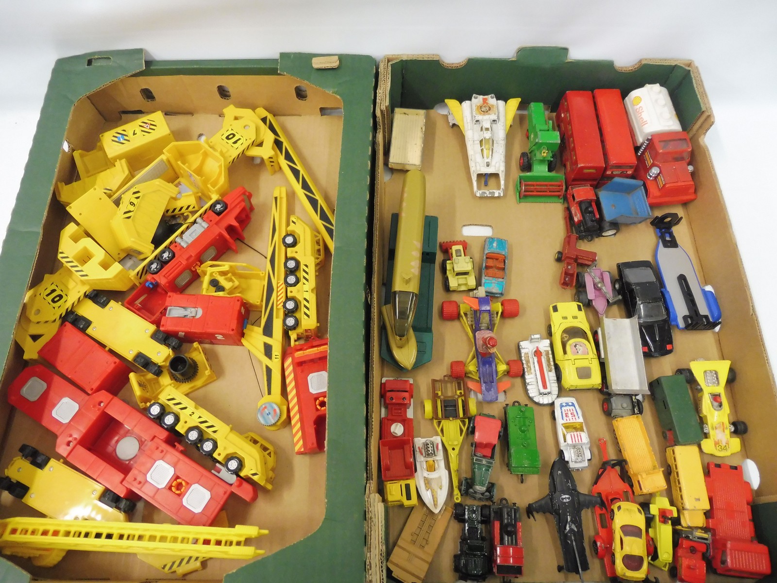 A collection of die-cast and plastic vehicles, various makers.