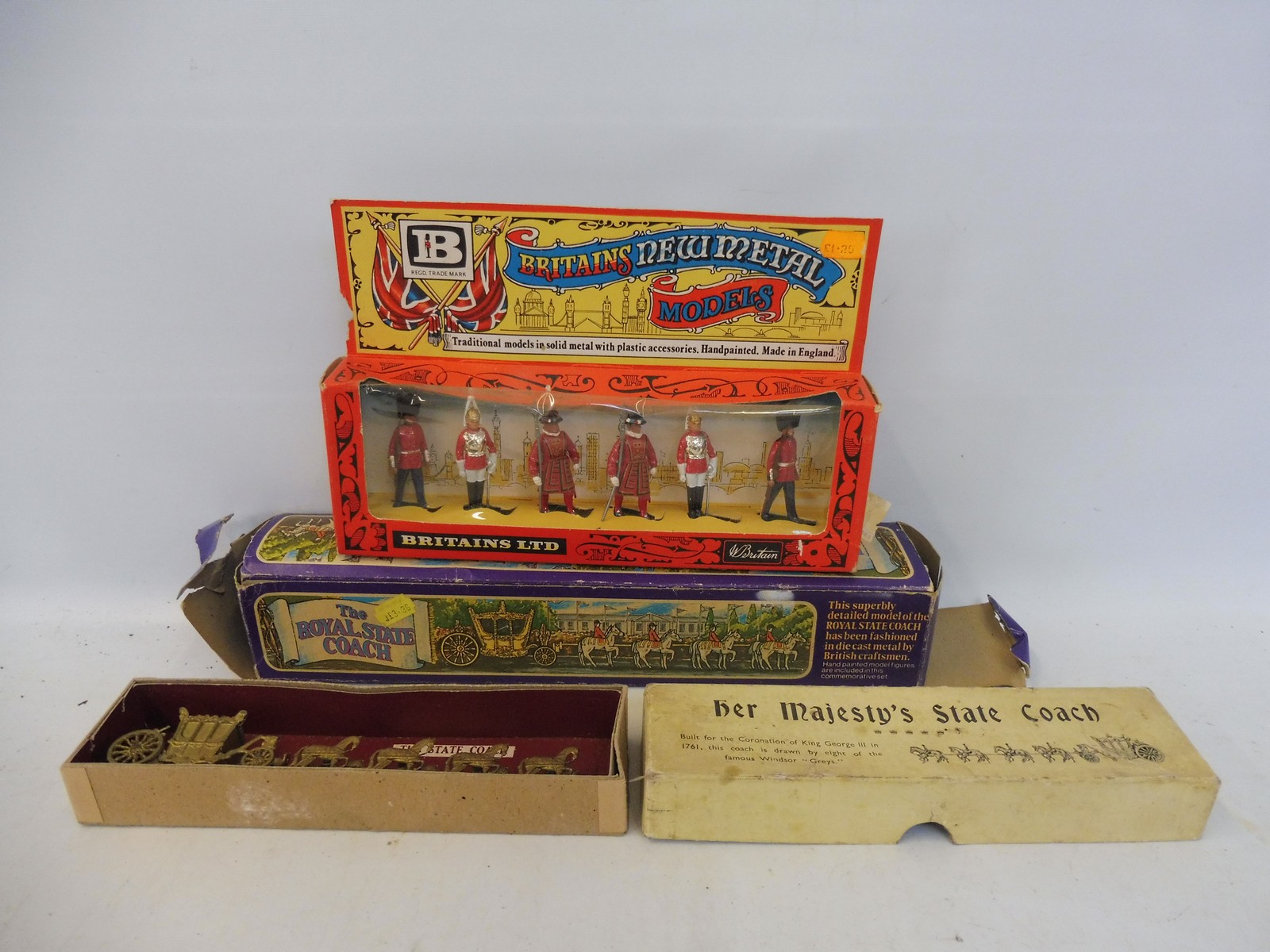 A Britains ceremonial solider set and a boxed state coach, also a boxed Royal Stage Coach, by
