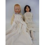 A German bisque headed doll by Armand Marseille, 351/2 1/2 LK, plus an English bisque headed doll.