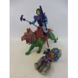 An original He Man battlecat with armour, skeletor with armour, lance and sword, plus one other.