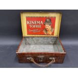 An early suitcase shaped tin with advertising to the inside of the lid, from Kinema Toffee and an