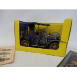 A Schuco 'Opel' tinplate clockwork car, no. 1228, with partial box and leaflet and key.