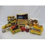 A selection of construction models from the 1960s to modern day, to include a Marx tractor, a