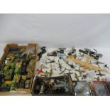 A large quantity in two boxes of military die-cast models, to include tanks, aeroplanes etc.