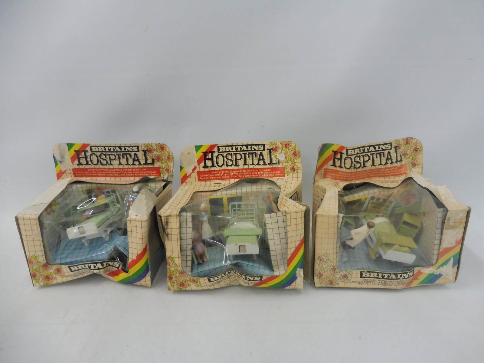 Britains Hospital - three sets, boxes poor condition, figures and accessories appear excellent.