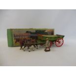 An early Britains farm wagon, box no 5F, in playworn condition but appears complete.
