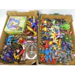 A large quantity of plastic action figures to include Ghostbusters, Thunder Cats etc.