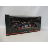 A boxed 1:18 scale McLaren Gulf sports car.