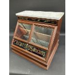 A very unusual Crawford's Biscuits counter top marble topped, mahogany dispensing cabinet with two