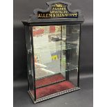 A rare shop counter top rear opening dispensing cabinet with glass pediment for Jujubes &