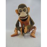 A Japanese battery powered part tinplate clapping monkey with a pair of cymbols.