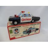 A boxed Japanese tinplate highways police car, unchecked, but box and car appear in very good