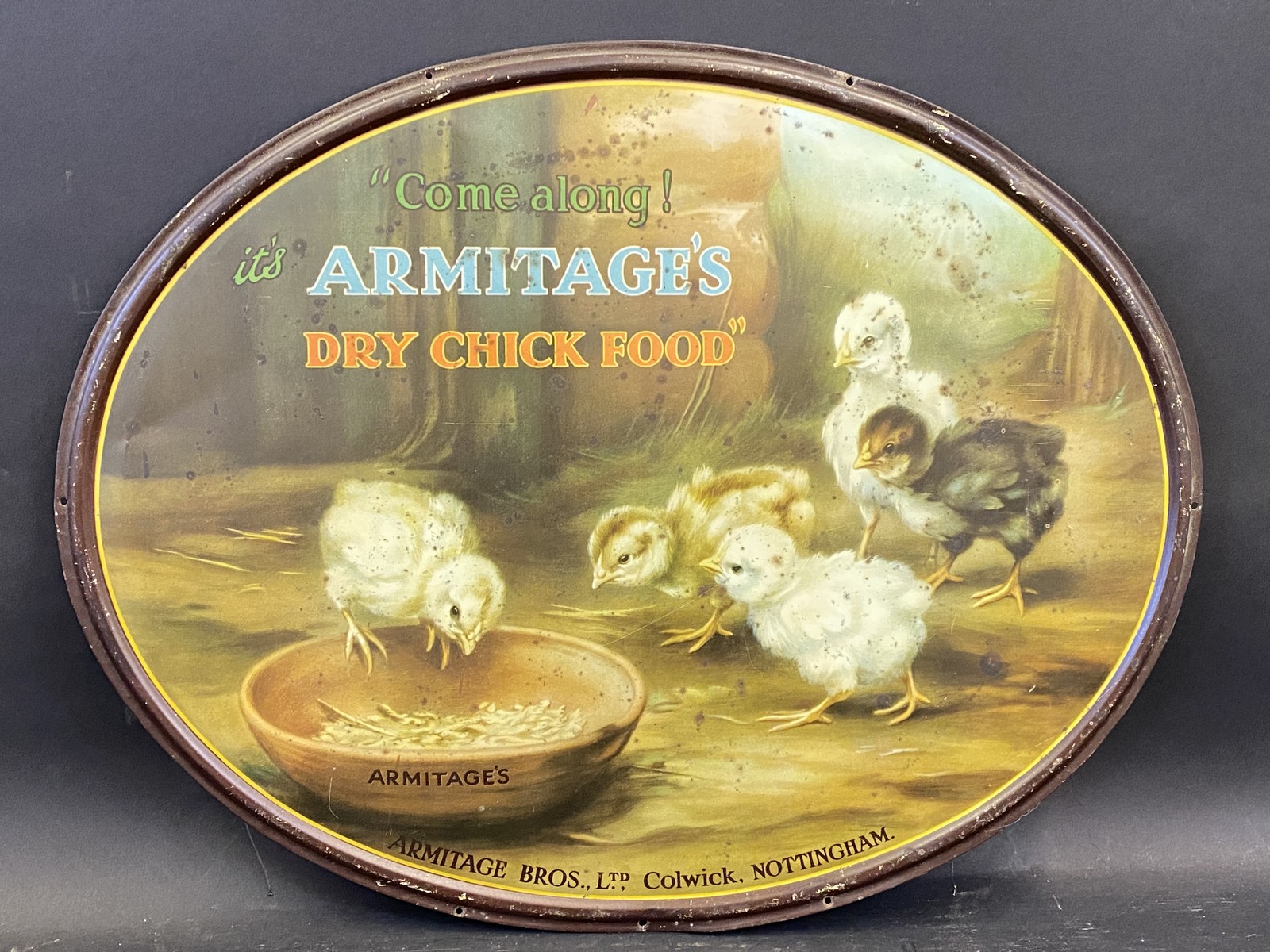An Armitage's Dry Chick Food oval tin advertising sign, 17 3/4 x 14".