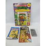 A selection of carded period tv related toys to include Transformers, Judge Dredd etc.