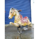 An original circa 1950s juvenile fairground horse, with stand, for restoration.