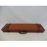 A canvas and leather edged shotgun case by Brady, 32 3/4" long.