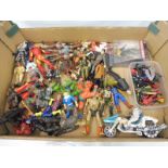 A tray of loose action figures, covering many genres.