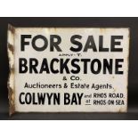 A 'For Sale' double sided enamel sign with hanging flange, for Brackstone & Co. Auctioneers & Estate