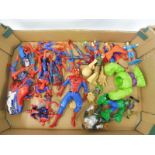 A tray of action figures to include Spider Man, Superman, and Hulk.