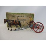 An original Britains Home Farm Series no. 8F horse rake.