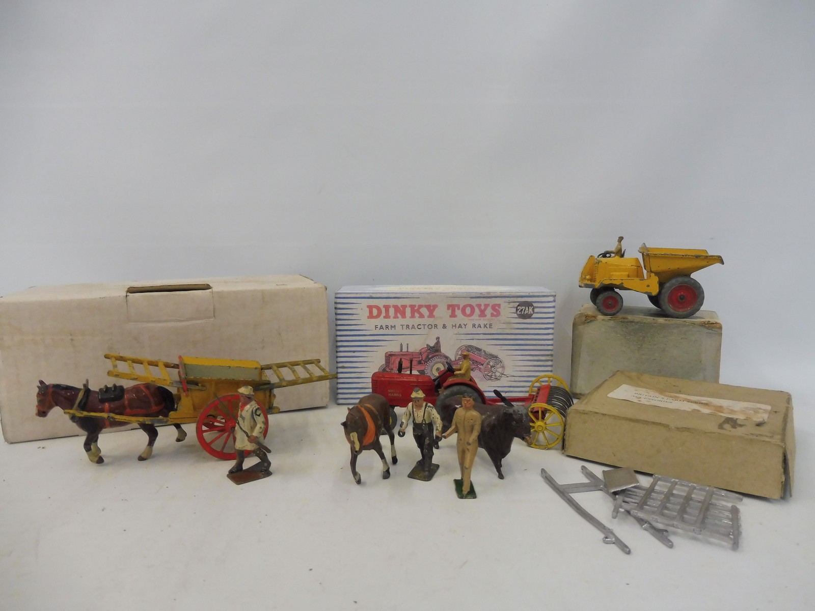 A selection of Britains farm and Dinky, to include a farm tractor and hay rake in a reproduction