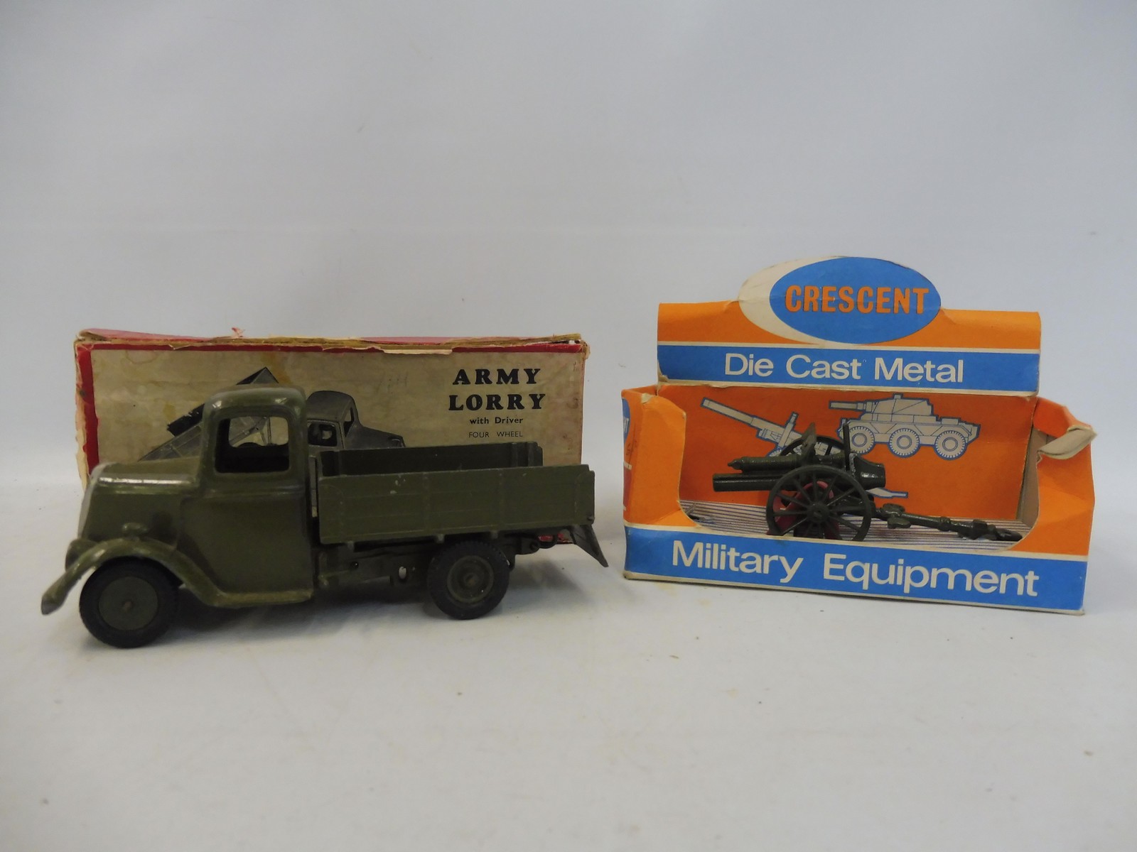 An early Britains army lorry, boxed, plus a Crescent boxed quick-firing gun.