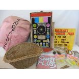 An assortment of fairground items to include wooden hoopla hoops, glass fishbowls, candy floss