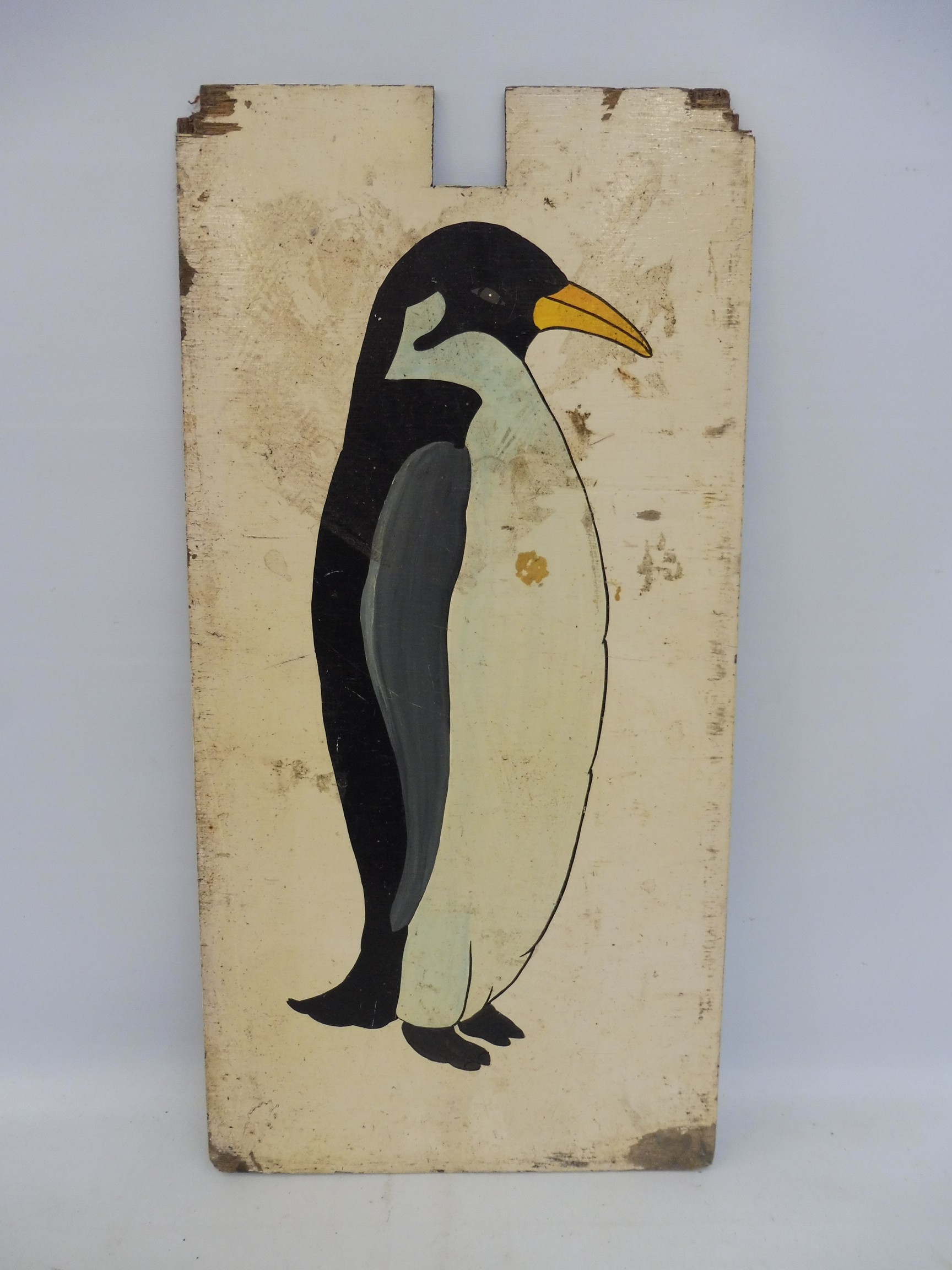 A hand painted penguin fairground panel from a hoopla stall, circa 1970s, 23 x 12".