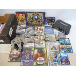 A box of videos, older gaming equipment, Playstation 2 games (all unchecked).
