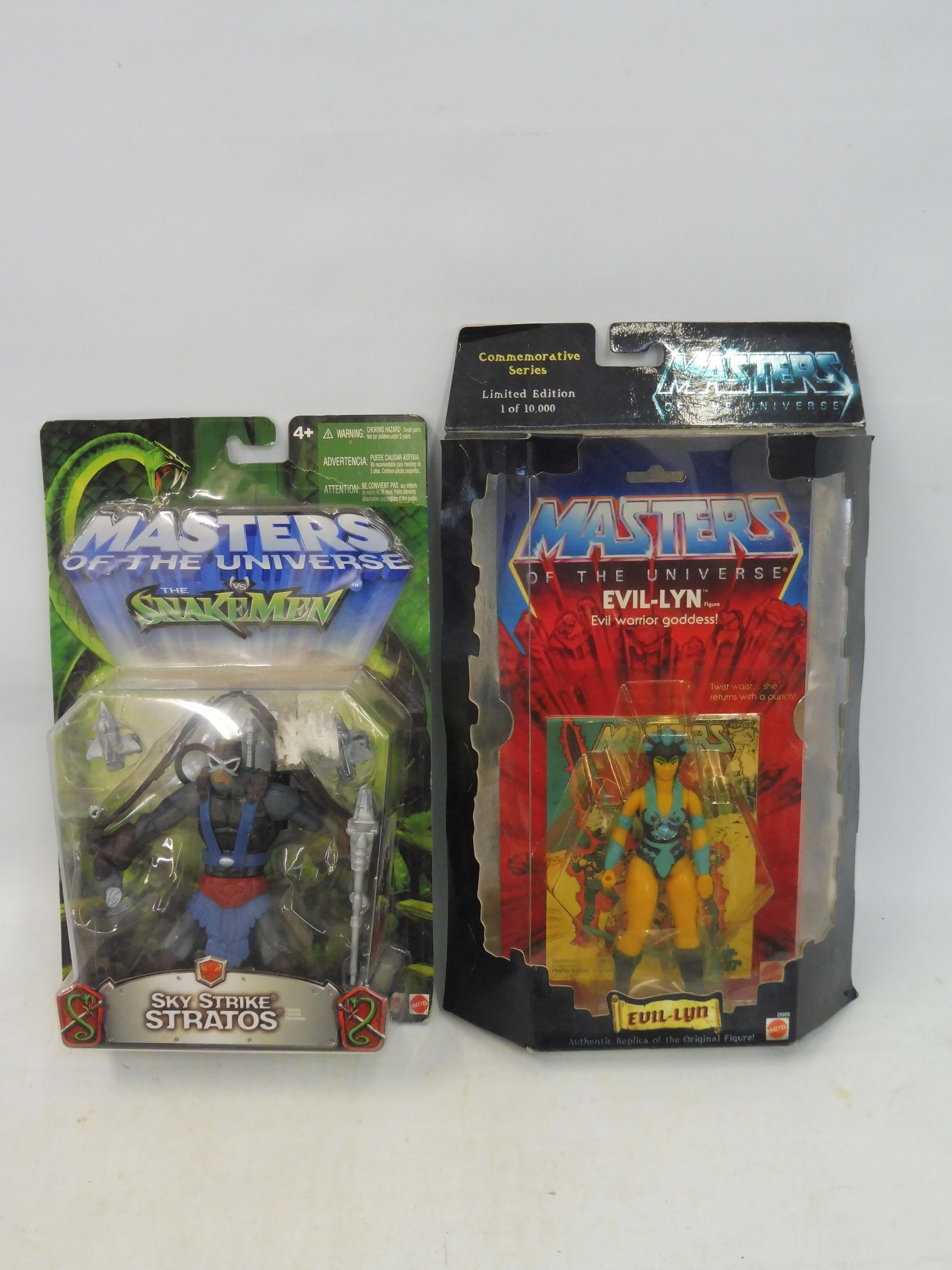 Two boxed and carded Masters of the Universe - Evil Lyn and Sky Strike Stratos.