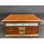 A G.L. Turney's Best Needles mahogany counter top dispensing cabinet with rising lid, milk glass