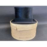 A Lock & Co silk top hat in a Christy & Co hat box.