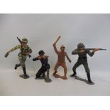 Four unusual Marx plastic large scale soldiers, three in WWII German uniforms, the other a WWII